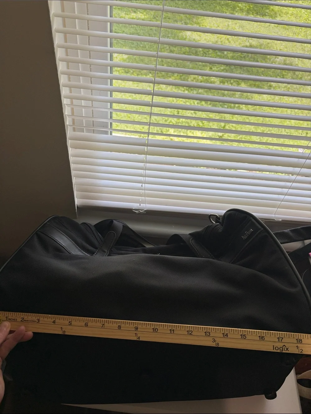 Hartmann zip around nylon and leather duffle style bag.